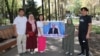 Protesters with relatives believed to be imprisoned in Beijing’s camp system in Xinjiang hold a small gathering in Almaty on September 5.