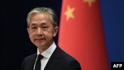 د چین د بهرنیو چارو وزارت ویاند وانګ وېنبېن د یوې خبري غونډې پر مهال - پخوانی انځور.