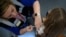 FRANCE-HEALTH-VACCINATION-HPV-PAPILLOMAVIRUS-EDUCATION/ A nurse injects a dose of human papillomavirus (HPV) vaccine at Theodore Monod college in Vern-sur-Seiche, suburb of Rennes, western France on October 9, 2023.