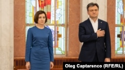 Președinta Maia Sandu și premierul Dorin Recean, la ceremonia de depunere a jurământului de către trei membri noi ai Guvernului, iulie 2023