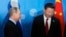 Президент России Владимир Путин (слева) и его китайский коллега Си Цзиньпин.