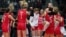 Serbian women volleyball players celebrate their victory over the United States in the semifinals of the World Championship. After they won the tournament this month, the team received a donation worth hundreds of thousands of euros from a Chinese mining company. 
