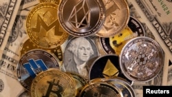 Representations of virtual cryptocurrencies are placed on U.S. Dollar banknotes in this illustration