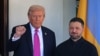 US President Donald Trump gestures as he greets Ukrainian President Volodymyr Zelensky at the White House in Washington, DC, on October 17. 