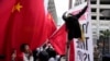 Supporters and critics of Chinese President Xi Jinping converge near the site of the 2023 APEC Summit in San Francisco. 