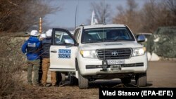 OSCE observers work at a checkpoint close to Zolote in the Luhansk region earlier this month.
