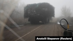 A Ukrainian armored vehicle fitted with metal wire armor on a road near Pokrovsk on November 23