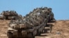 A convoy of Israeli tanks is deployed at Israel's border with the Gaza Strip on September 16, 2025.