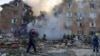 Firefighters and rescuers work at the site of a residential building hit by a massive Russian missile attack on Kyiv on August 28.