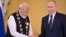 Russian President Vladimir Putin decorates Indian Prime Minister Narendra Modi with the Order of St. Andrew the Apostle the First-Called during a ceremony following their talks at the Kremlin in Moscow on July 9. 