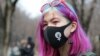 KAZAKHSTAN -- A demonstrator takes part in a march to mark International Women's Day in Almaty, March 8, 2021