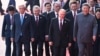 Chinese leader Xi Jinping walks with foreign leaders at a military parade in Beijijng on September 3. 