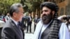 Taliban Foreign Minister Amir Khan Muttaqi welcomes Chinese Foreign Minister Wang Yi to Kabul ahead of a August 20 trilateral meeting with Pakistan. 