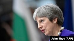 Британський прем’єр-міністр Тереза Мей промовляє до журналістів, прибувши на саміт ЄС у Брюсселі 22 березня 2018 року. 