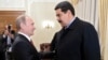 Russian President Vladimir Putin (left) welcomes Venezuela's Nicolas Maduro at Putin's Novo-Ogaryovo residence outside Moscow in 2015.