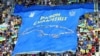 Українські фани розгорнули банер під час футбольного матчу України з Вірменією у місті Лодзь (Польща), 11 червня 2022 року 