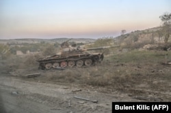 A destroyed tank near the empty village where Hayk was fighting