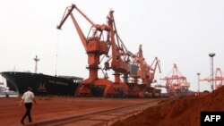 Soil containing various rare-earth elements waits to be loaded on to a ship at a port in Lianyungang, China. (File photo)