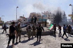 Бойцы сирийской правительственной армии в преимущественно друзском городе Эс-Сувайда. 15 июля 2025 года