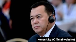 Who is backing Mirlan Bakirov?