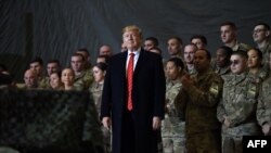 US President Donald Trump speaks to the troops during a surprise Thanksgiving day visit at Bagram airbase in 2019. 