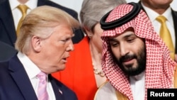 US President Donald Trump (left) speaks with Saudi Arabia's Crown Prince Muhammad bin Salman at a G20 summit in Japan in 2019.