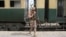 A Pakistan Army soldier stands guard next to a rescue train at the railway station in Mushkaf, Balochistan, on March 12 after an attack by separatist militants the day before. 