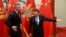 Chinese Prime Minister Li Keqiang (right) greets Montenegro' then-Prime Minister Milo Djukanovic during their meeting n Beijing in 2015. 