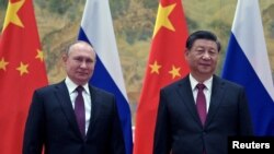 Россия президенти Владимир Путин ва Хитой раиси Си Цзиньпин.