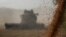 FILE PHOTO: Wheat harvest in Omsk region