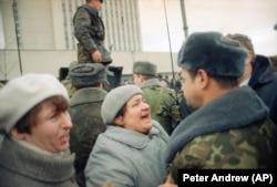 A Lithuanian woman remonstrates with a Soviet soldier in Vilnius in January 1991.