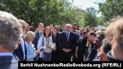 Diplomats visit the site of a strike on a residential building hit by a massive Russian strike on Kyiv on August 28.