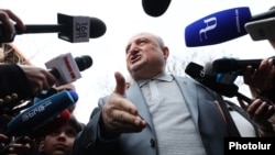 Armenia - Former Mayor Vartan Ghukasian speaks to journalists outside a polling station in Gyumri, March 30, 2025.